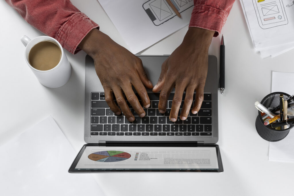 top view hands typing keyboard